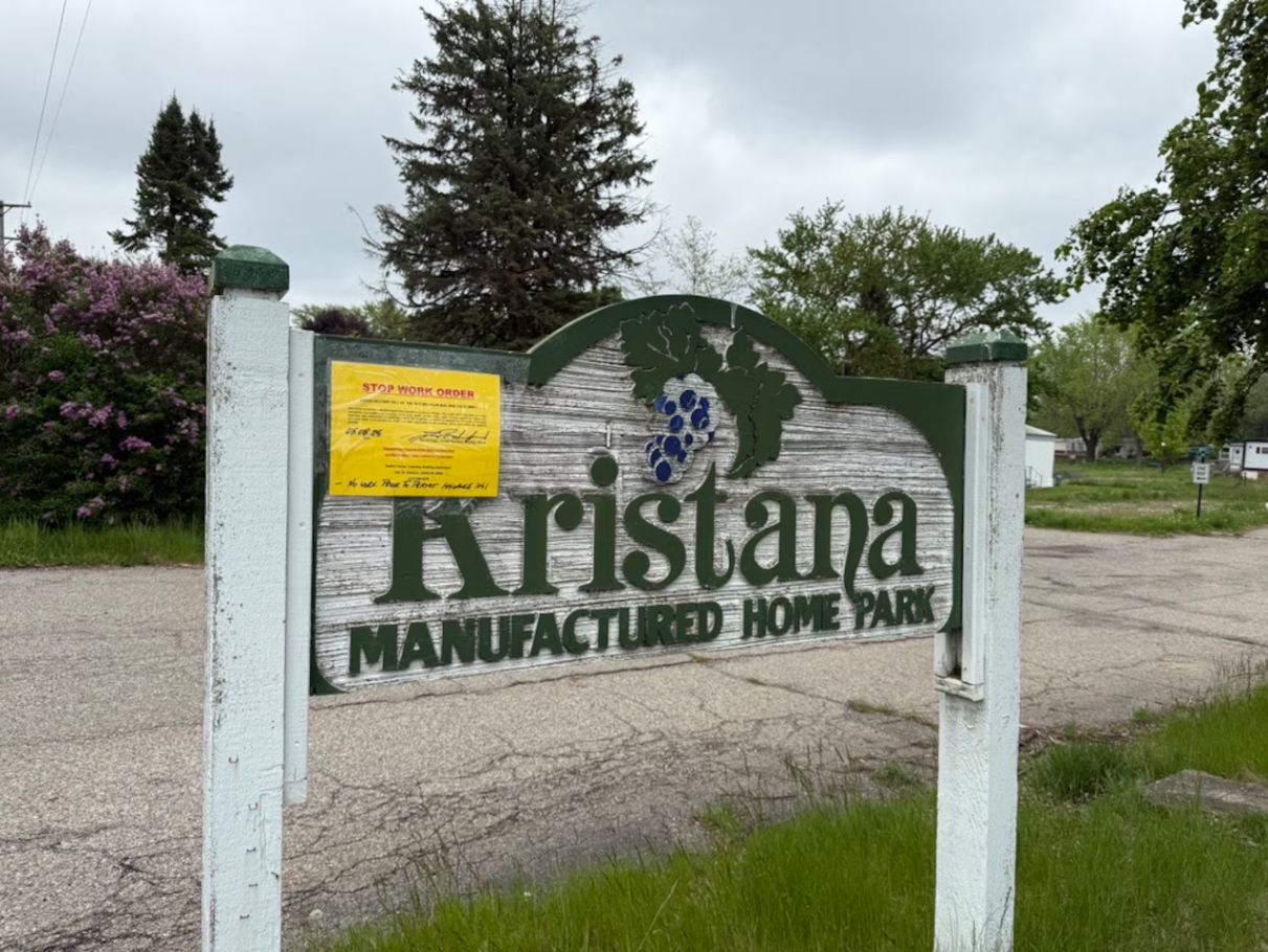 Screenshot 2025-07-03 095316 A bright yellow stop work order sign outside Kristana Manufactured Home Park