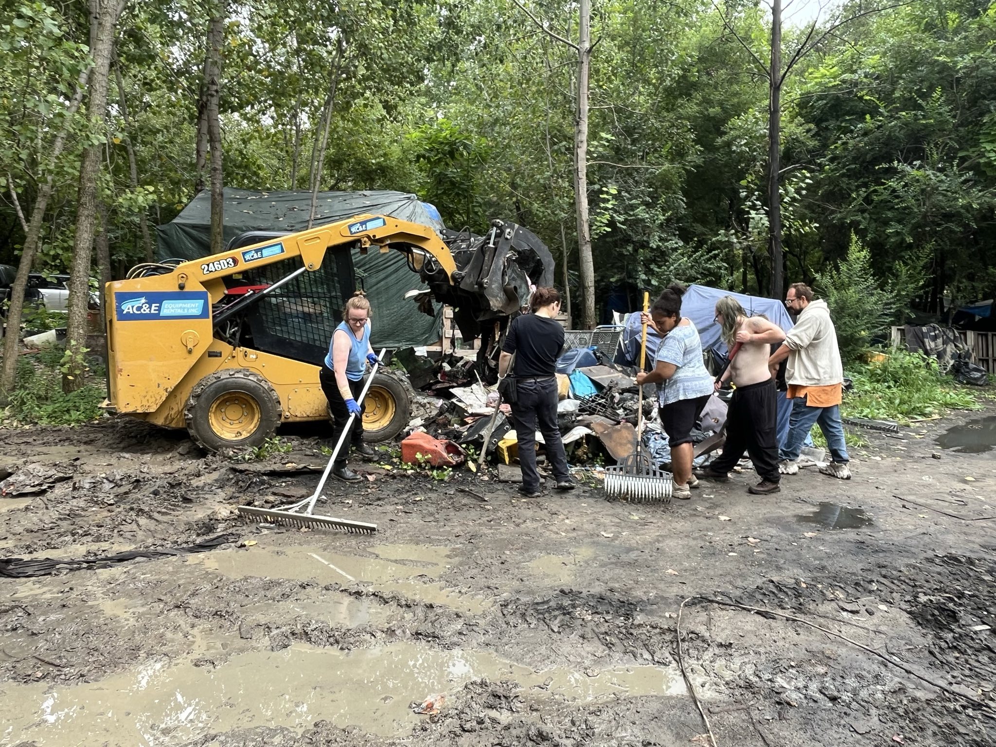 RITDH helps clean up local homeless camp alongside the residents.